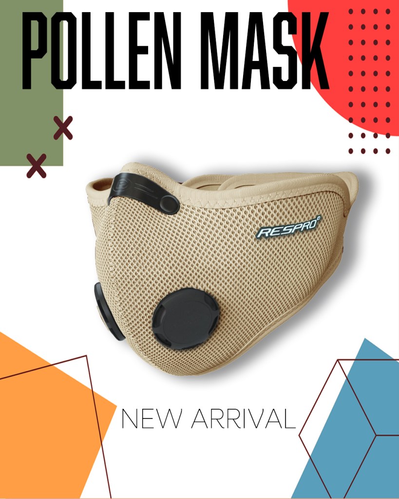A sand Respro® Pollen Mask displayed against a colourful geometric background, emphasising its new arrival status.